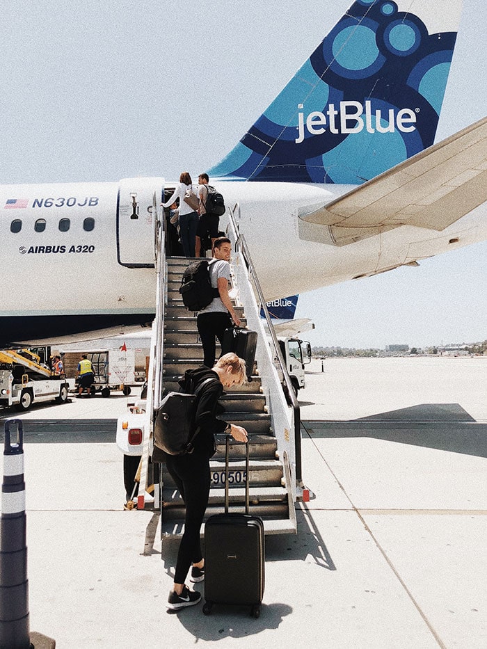 What Is TSA PreCheck - woman boarding plane on tarmac