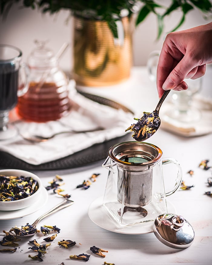 Butterfly Pea Flower Tea Latte - adding tea to teapot