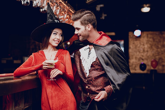 Halloween Jokes - Guy Dressed as Vampire Hitting on Woman Dressed as Witch at Party